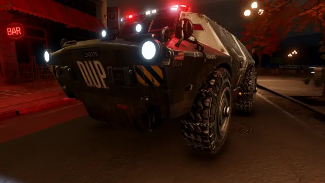The APC's front at night, headlights on